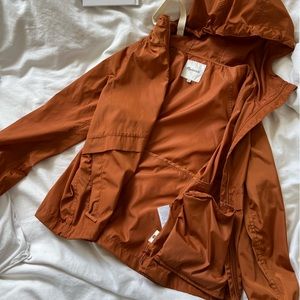 Madewell packable burnt orange raincoat, size XS